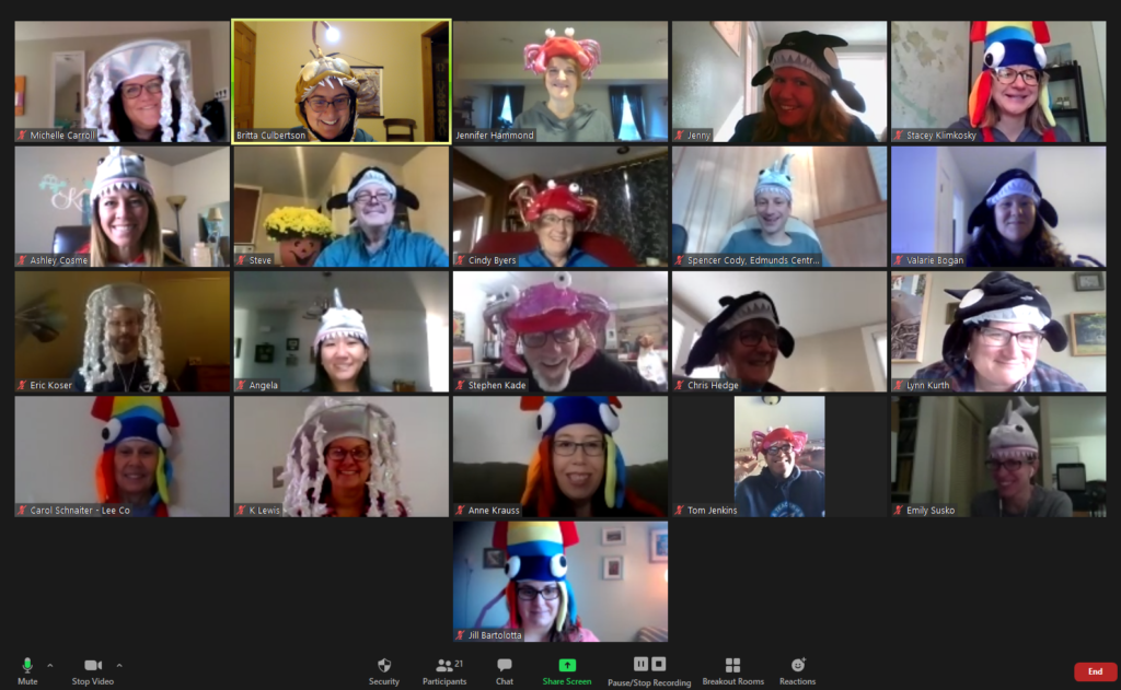 A Zoom meeting with adults wearing Halloween hats in various marine themes.