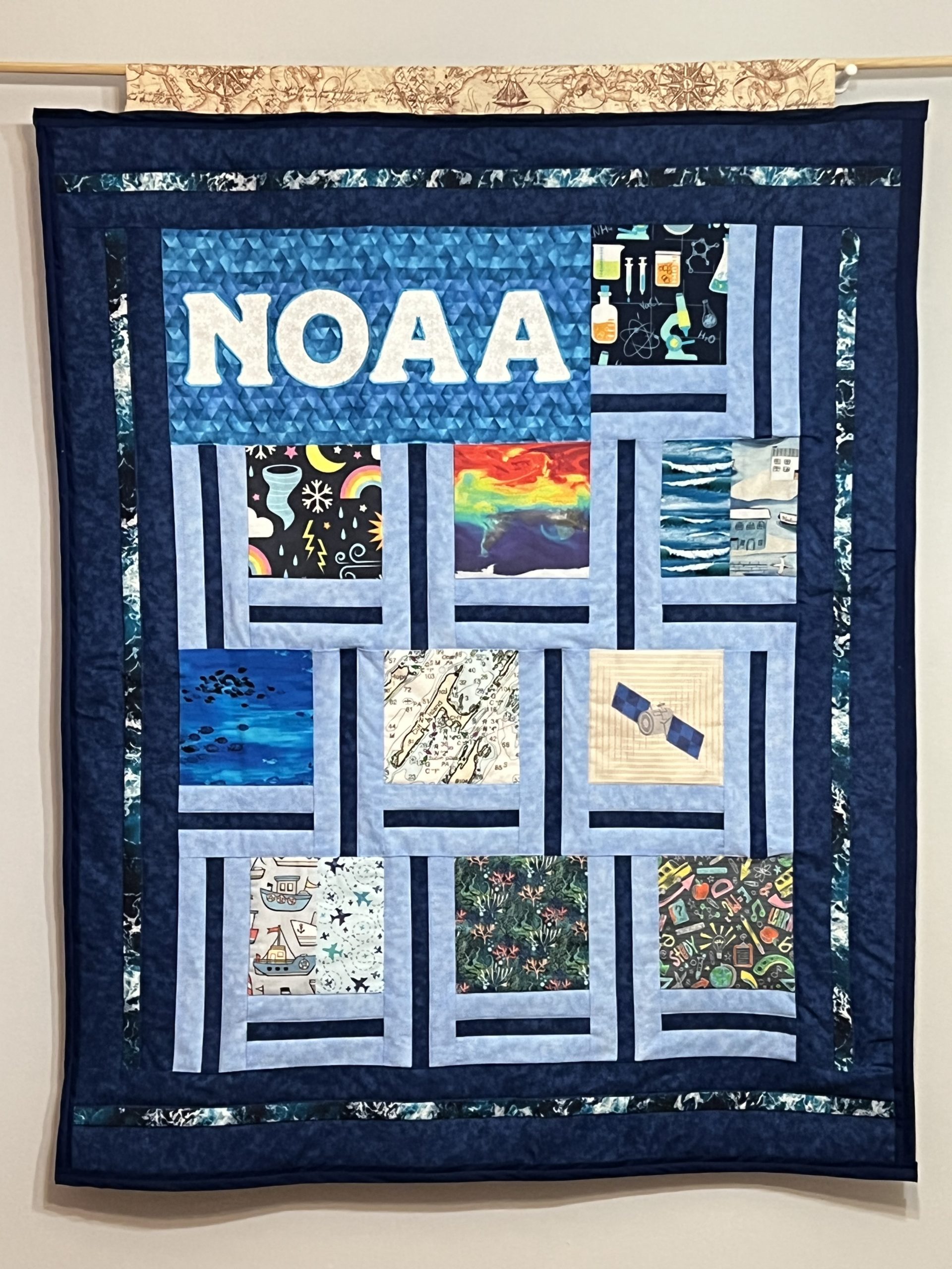 NOAA quilt featuring patches of individual artwork pieces