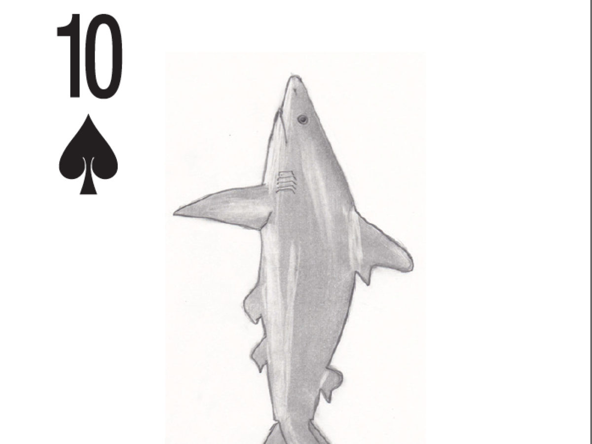 A ten of clubs card with a drawn shark.