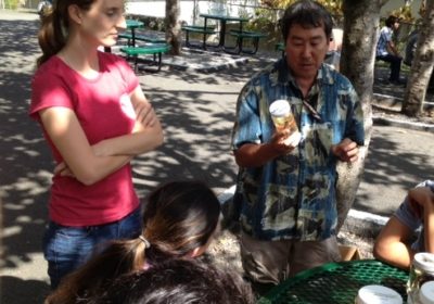 A man and a woman share trawl specimens with students.