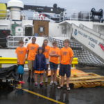 Student campers stand in front of the NOAA ship Thomas Jefferson.