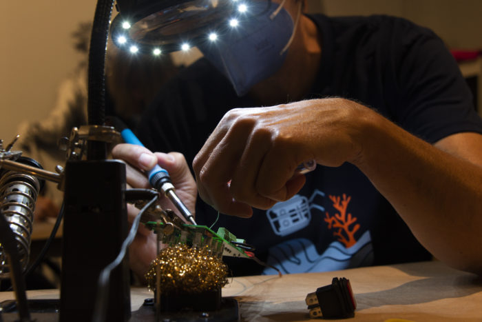 Person working on circuit board