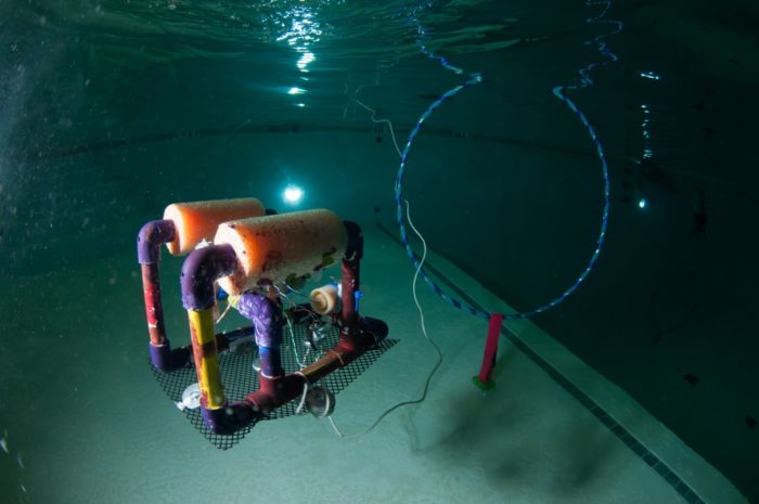 Mini ROV being piloted through a hoop