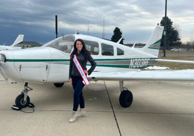 Ashley Cosme Mrs Indiana-American 2023 in front of small plane