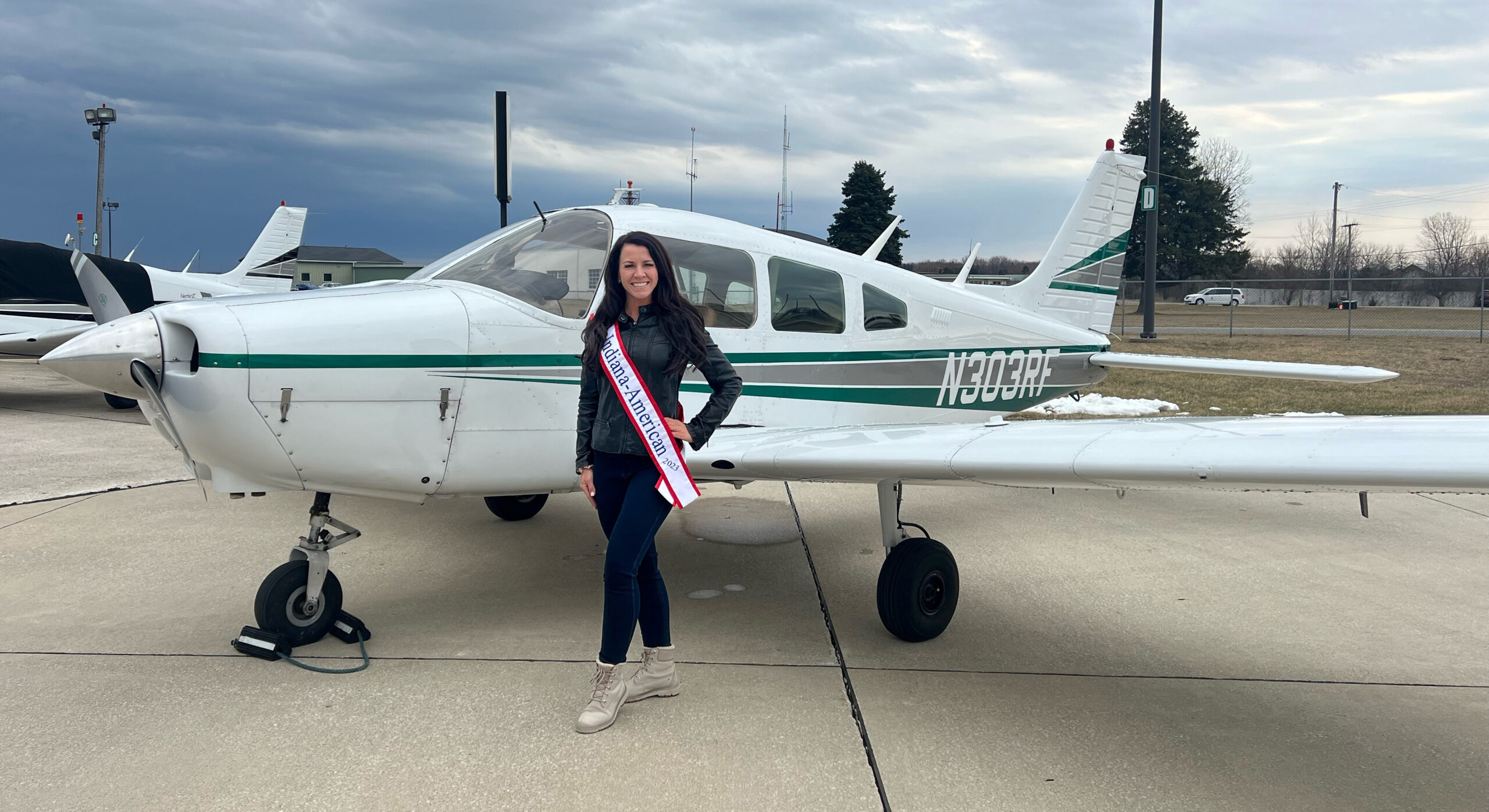 Ashley Cosme Mrs Indiana-American 2023 in front of small plane