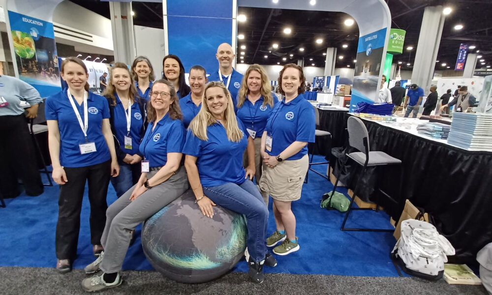 Teacher At Sea Alumni staffing booth at 2023 NSTA Conference