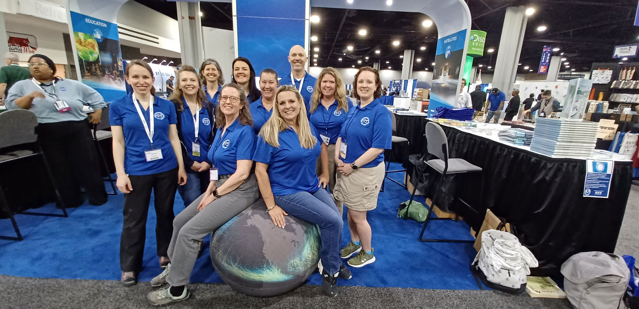 Teacher At Sea Alumni staffing booth at 2023 NSTA Conference