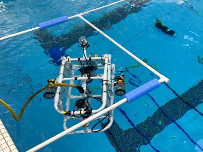 Mini ROV floating in a pool